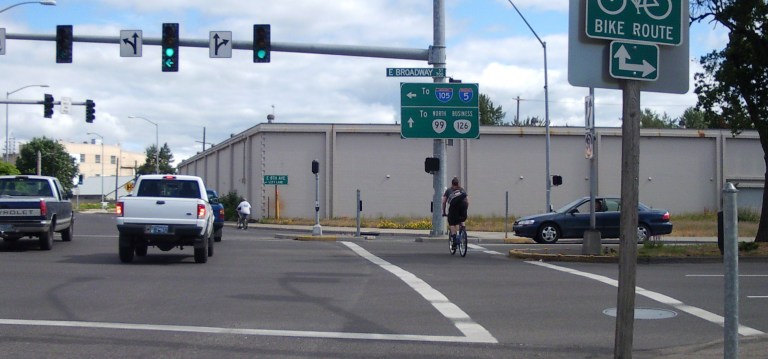 Cyclists navigating Broadway and Hilyard in Eugene