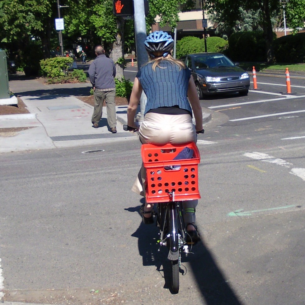 Buns hanging over into a bicycle crate