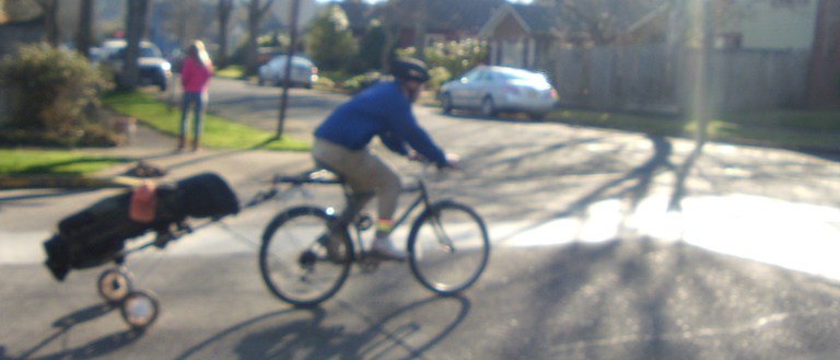 Towing golf clubs on 17th Avenue